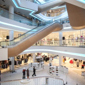 Modern interior of TSUM Kyiv with escalators and shopping areas