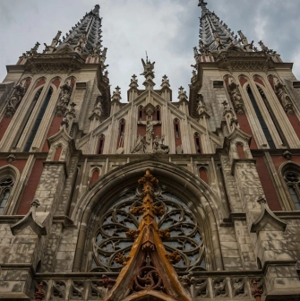 Bottom view of the facade of St. Nicholas Church with details of Gothic architecture