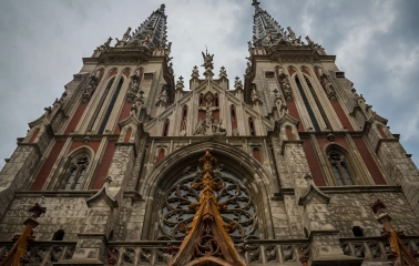 Bottom view of the facade of St. Nicholas Church with details of Gothic architecture