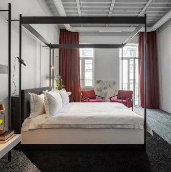 Minimalist room at the Bursa Hotel in Kyiv with wooden panels