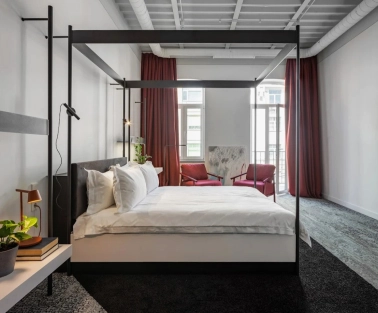 Minimalist room at the Bursa Hotel in Kyiv with wooden panels
