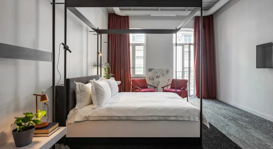 Minimalist room at the Bursa Hotel in Kyiv with wooden panels