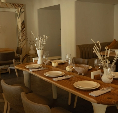 Restaurant Odesa - spacious dining room with a large wooden table set for a meal