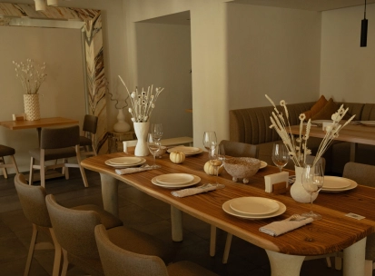 Restaurant Odesa - spacious dining room with a large wooden table set for a meal