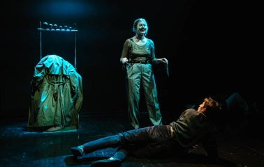 Molodyi Teatr in Kyiv - emotional stage performance with a smiling actress standing over an actor lying on the floor