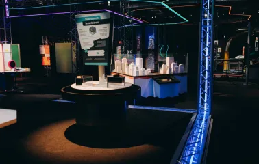 Museum of Mathematics Kuboid in Kyiv - modern interactive exhibit about tessellations featuring white architectural models and neon lighting in a dark museum hall