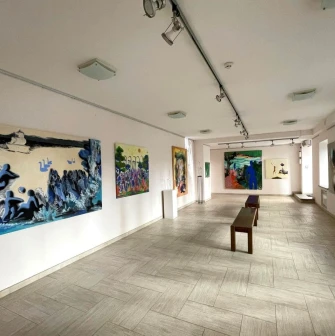 Paintings by contemporary Ukrainian artists in the exhibition hall of the Triptych Gallery in Kyiv