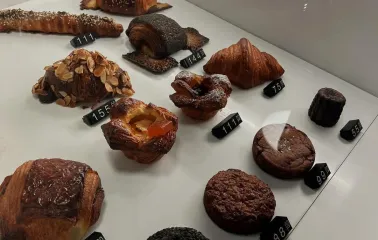 Spelta - counter display of various fresh baked goods including bread and pastries