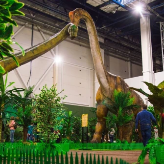 Giant animatronic dinosaur among artificial jungles in Lavina Dinopark