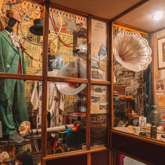 One Street Museum in Kyiv - showcase with costumes and a gramophone