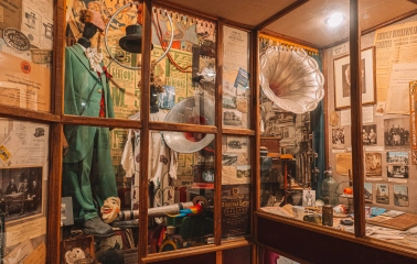 One Street Museum in Kyiv - showcase with costumes and a gramophone