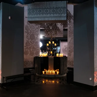 Hall of Memory in the Holodomor museum with candles and traditional ornaments
