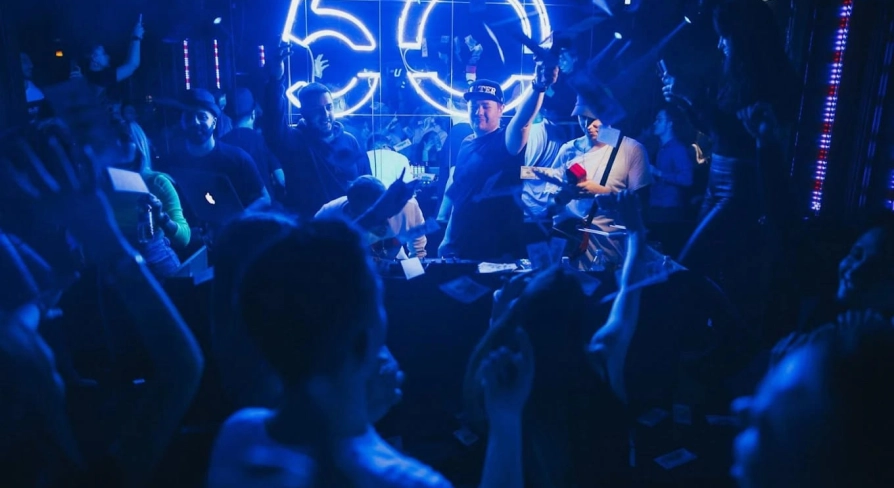 Party at the Fifty club in Kyiv with a lot of people and blue lighting