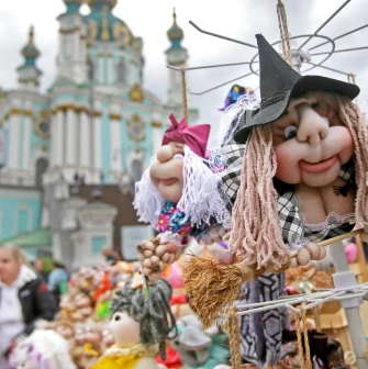Handmade souvenir dolls with a view of St. Andrew's Church in Kyiv