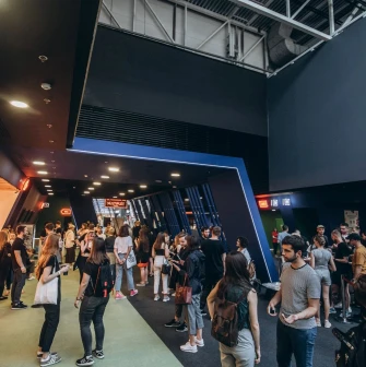 Waiting area and crowd of visitors in the Multiplex cinema lobby