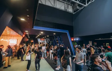 Waiting area and crowd of visitors in the Multiplex cinema lobby