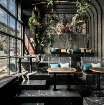 NAM - dining area featuring elegant dark furniture and unique light fixtures