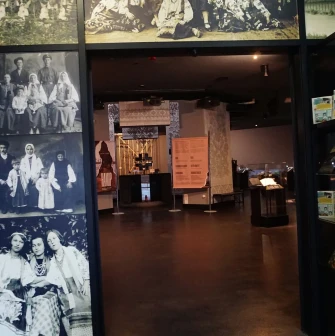 Entrance to the exhibition hall of the Holodomor museum with archival photos on the walls