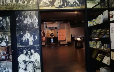 Entrance to the exhibition hall of the Holodomor museum with archival photos on the walls