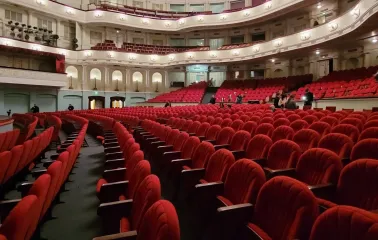 October Palace in Kyiv - empty auditorium with rows of red velvet seats
