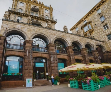 Restaurant Momenty - historic stone facade with arched windows and outdoor terrace