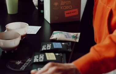 Idealist Coffee - display shelf with branded bags of coffee beans ready for sale