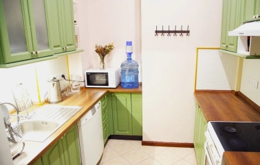 Kashtan Guest House - small, functional kitchen area with appliances and cabinets