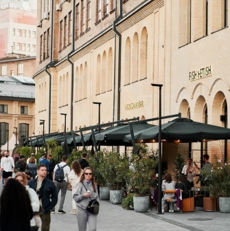 Entrance to Fish Fetish restaurant in Kyiv with terrace and umbrellas