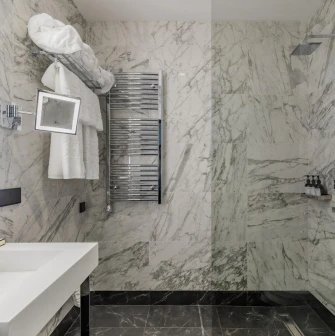 Luxurious marble-finished bathroom at the Edem hotel in Kyiv