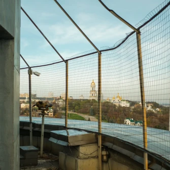 Motherland - view of Kyiv through the observation deck grid