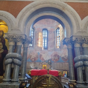 St. Cyril's Church in Kyiv - altar view with stone columns, icons and arched windows