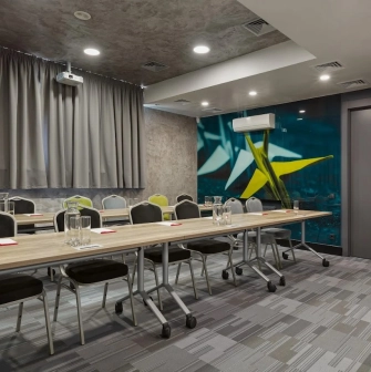 Ibis Kyiv City Center in Kyiv - meeting room with long tables and wall paintings