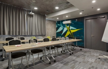 Ibis Kyiv City Center in Kyiv - meeting room with long tables and wall paintings