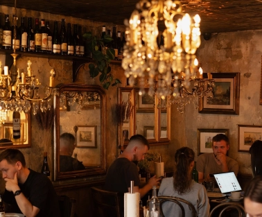 Cozy dining area at Mimosa Brooklyn Pizza restaurant in Kyiv with vintage decor