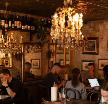 Cozy dining area at Mimosa Brooklyn Pizza restaurant in Kyiv with vintage decor