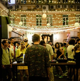 An outdoor concert under string lights at the "Hvlv" bar in Podil, Kyiv
