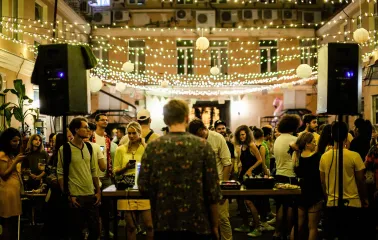 An outdoor concert under string lights at the "Hvlv" bar in Podil, Kyiv