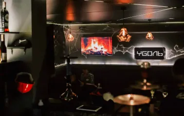 Vugol na Arsenalnii - cozy lounge interior with fireplace screen