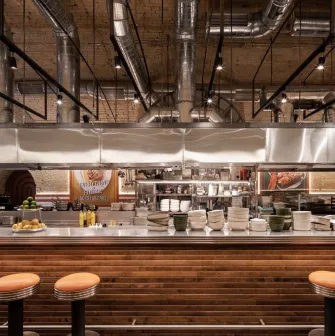 Bar counter with open kitchen at Fish Fetish restaurant in Kyiv