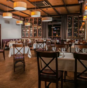 Restaurant Vero Vero - dining room interior with elegant chandeliers and tables set for guests