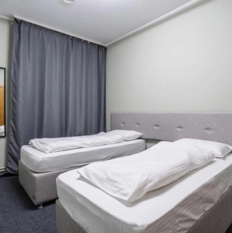 Kyiv Hostel - clean, private twin room with simple furniture