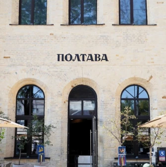 Poltava – restaurant exterior with brick facade and black arched windows