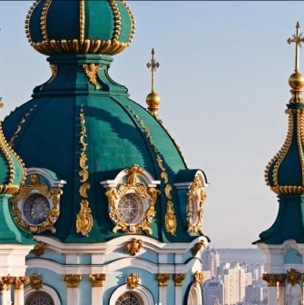 Turquoise domes of St. Andrew's Church with gilded decorative elements in Kyiv