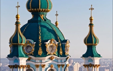 Turquoise domes of St. Andrew's Church with gilded decorative elements in Kyiv