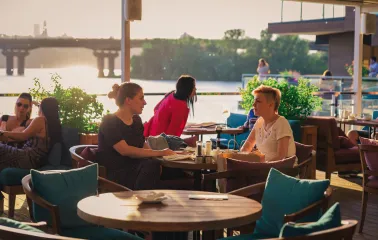 Mayak - spacious dining area offering a picturesque river view through windows