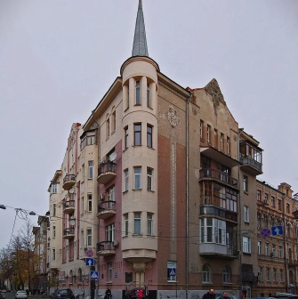Reitarska Street in Kyiv - a historic corner building with a sharp gray Gothic spire