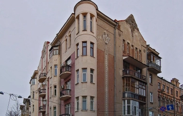 Reitarska Street in Kyiv - a historic corner building with a sharp gray Gothic spire