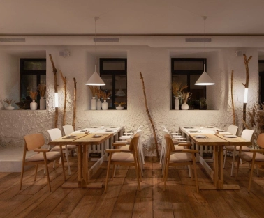 Restaurant 100 Rokiv Tomu Vpered - cozy tables near white textured walls and dark windows