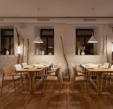 Restaurant 100 Rokiv Tomu Vpered - cozy tables near white textured walls and dark windows