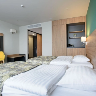 Room with two twin beds at the Favor Park Hotel in Kyiv